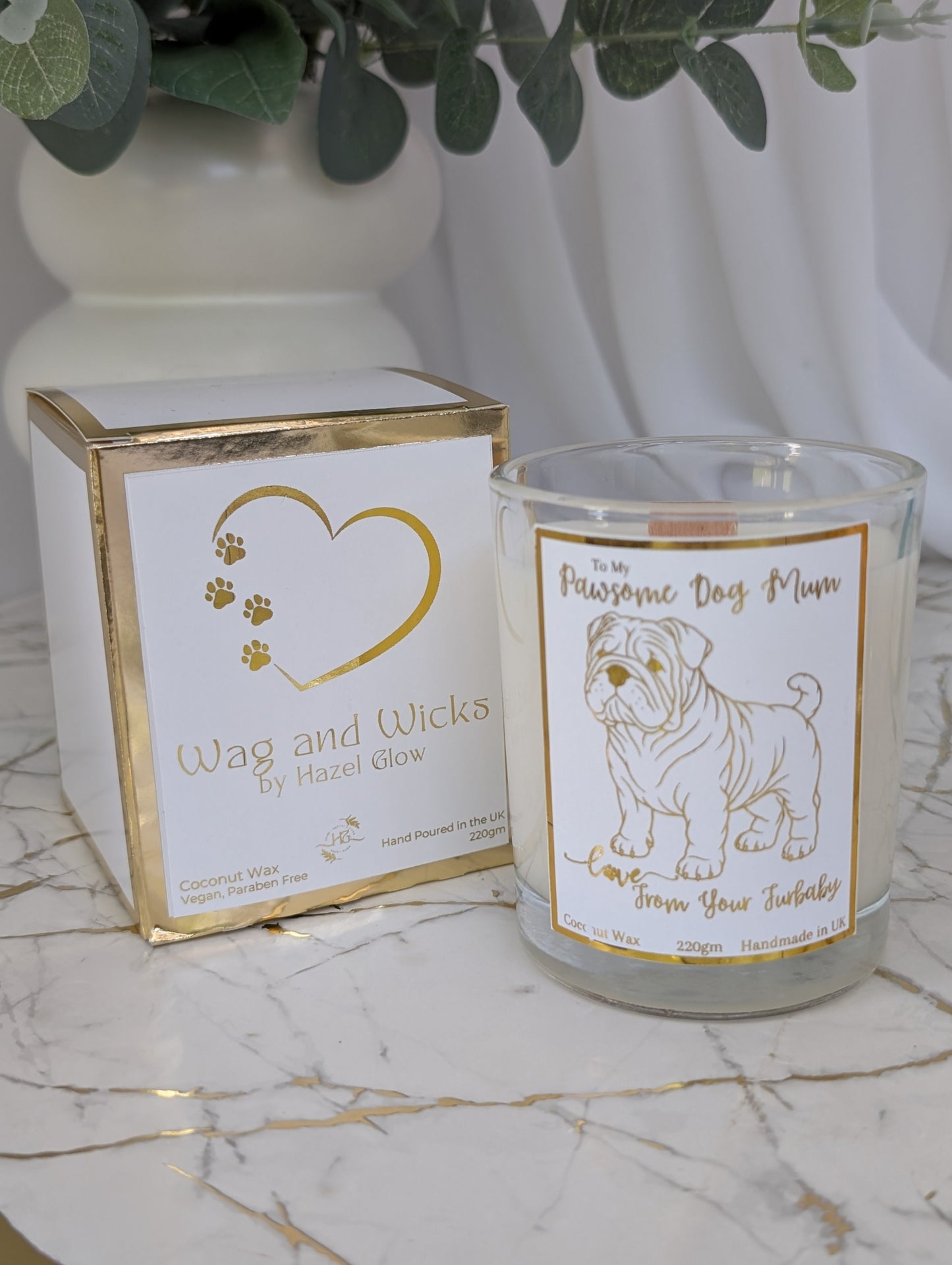 Dog Mum Candle. Front view of "Pawsome Dog Mum" candle in clear glass container - foiled label, with Wag and Wicks white and gold box