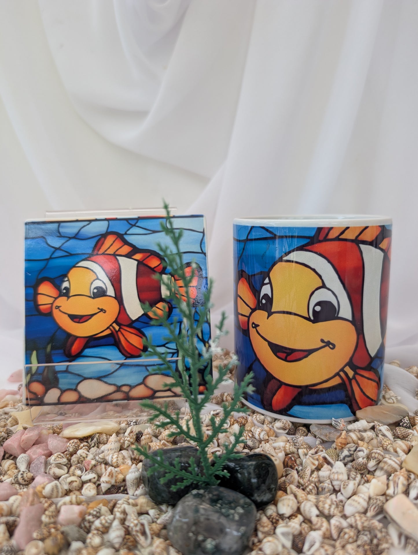 Clownfish Coaster in stained glass style shown with matching ceramic mug