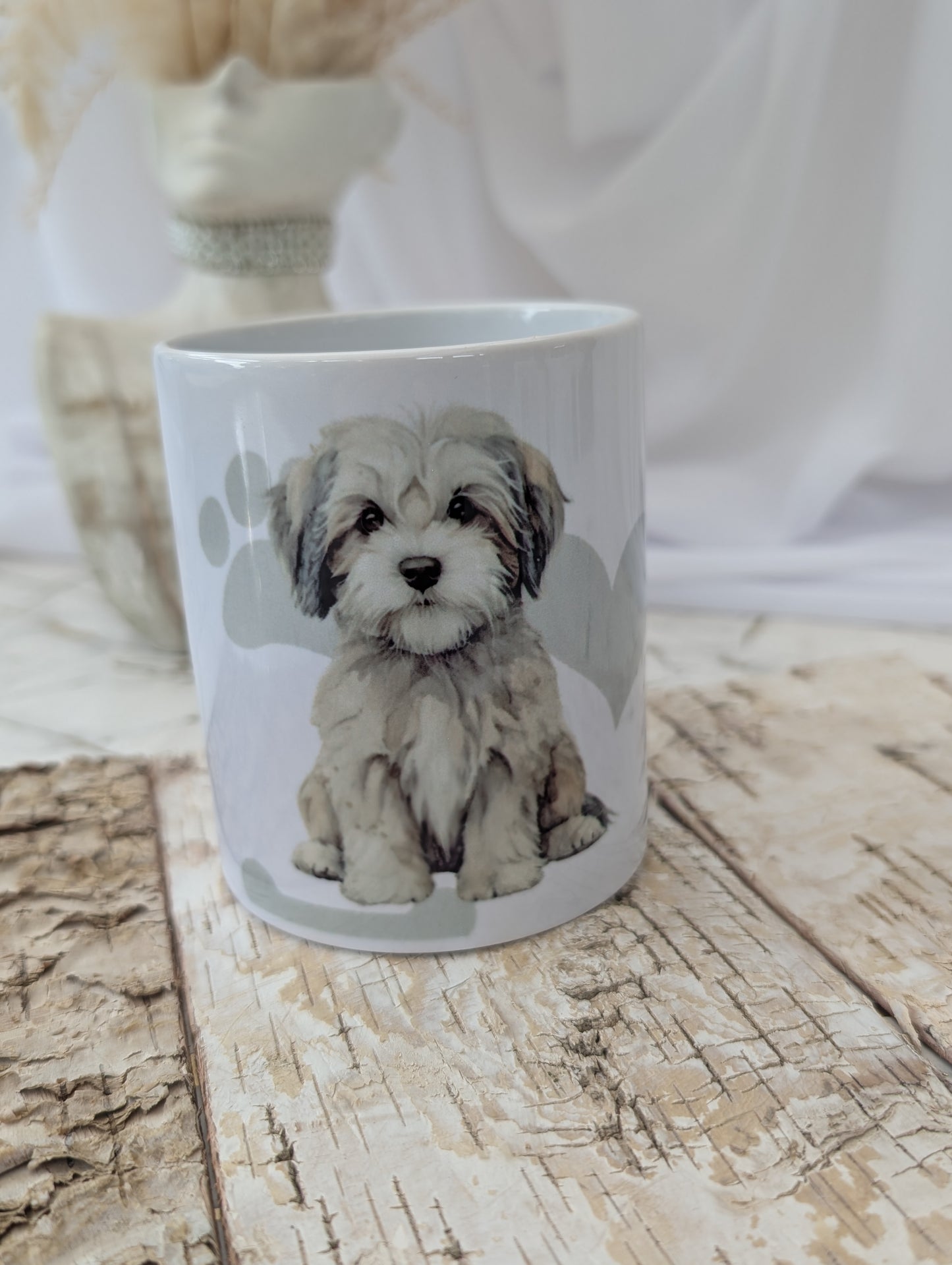 Front view of ceramic Havanese Dog mug with heart , paw and bone background in grey