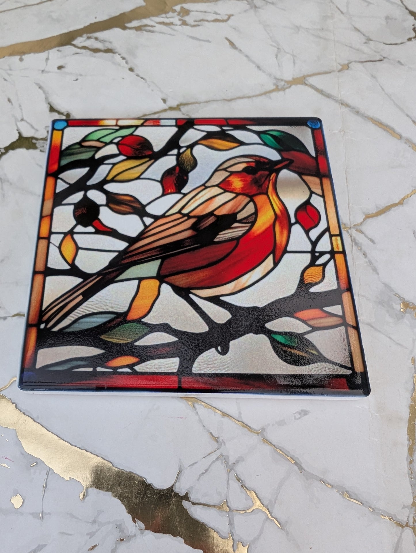 Top view of square ceramic stained glass style Robin coaster