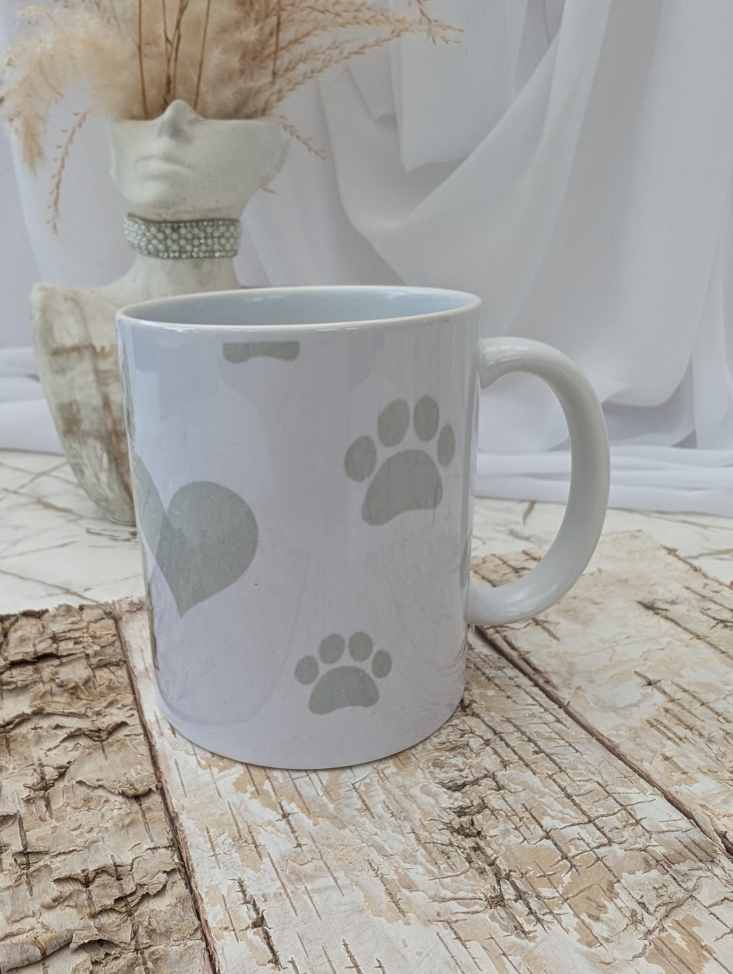Left side view of Western Highland Terrier mug with grey paws, heart and bones background