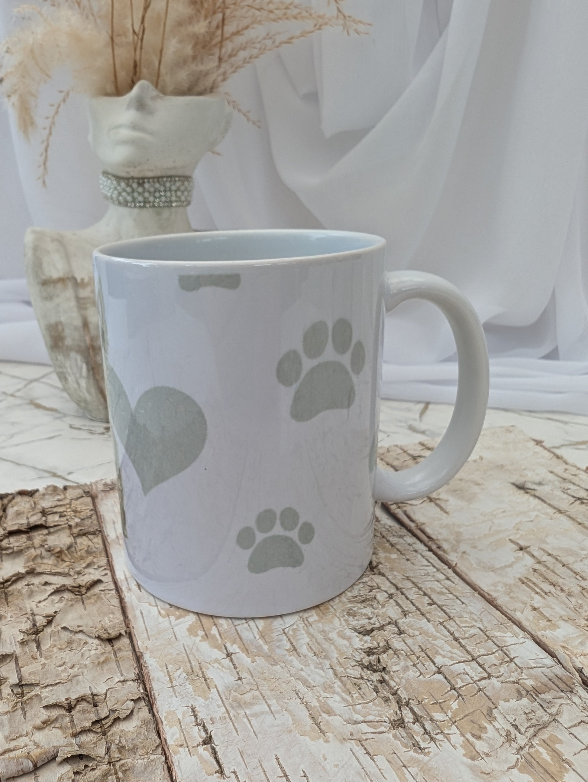 Left side view of Western Highland Terrier mug with grey paws, heart and bones background