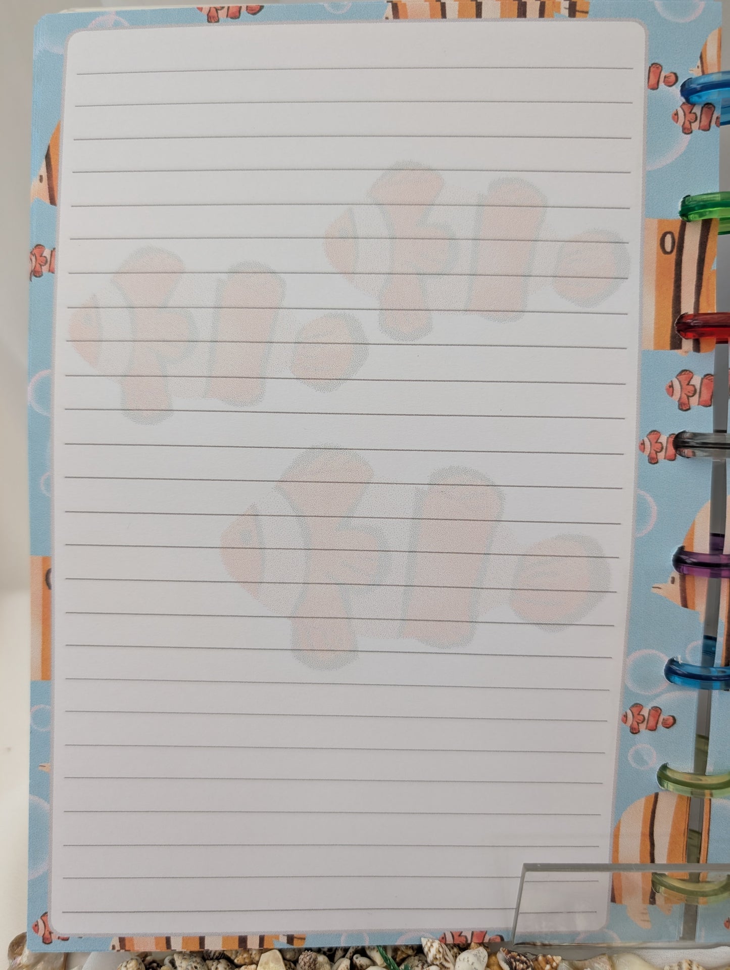Notebook with lined pages on a colorful background