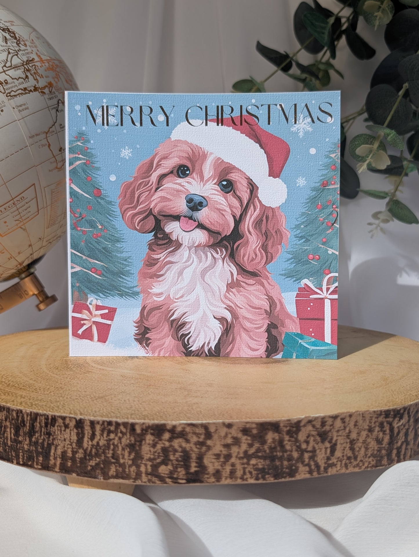 Personalised Dog Christmas card featuring a tan and white cockapoo/cavapoo wearing a Santa hat