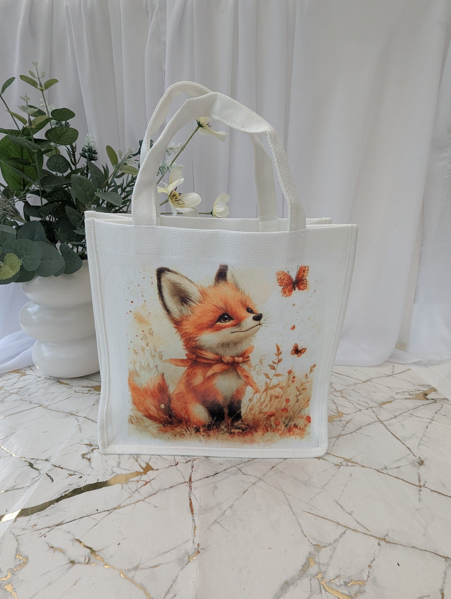 White linen effect fox tote bag with a cute fox design on a marble surface