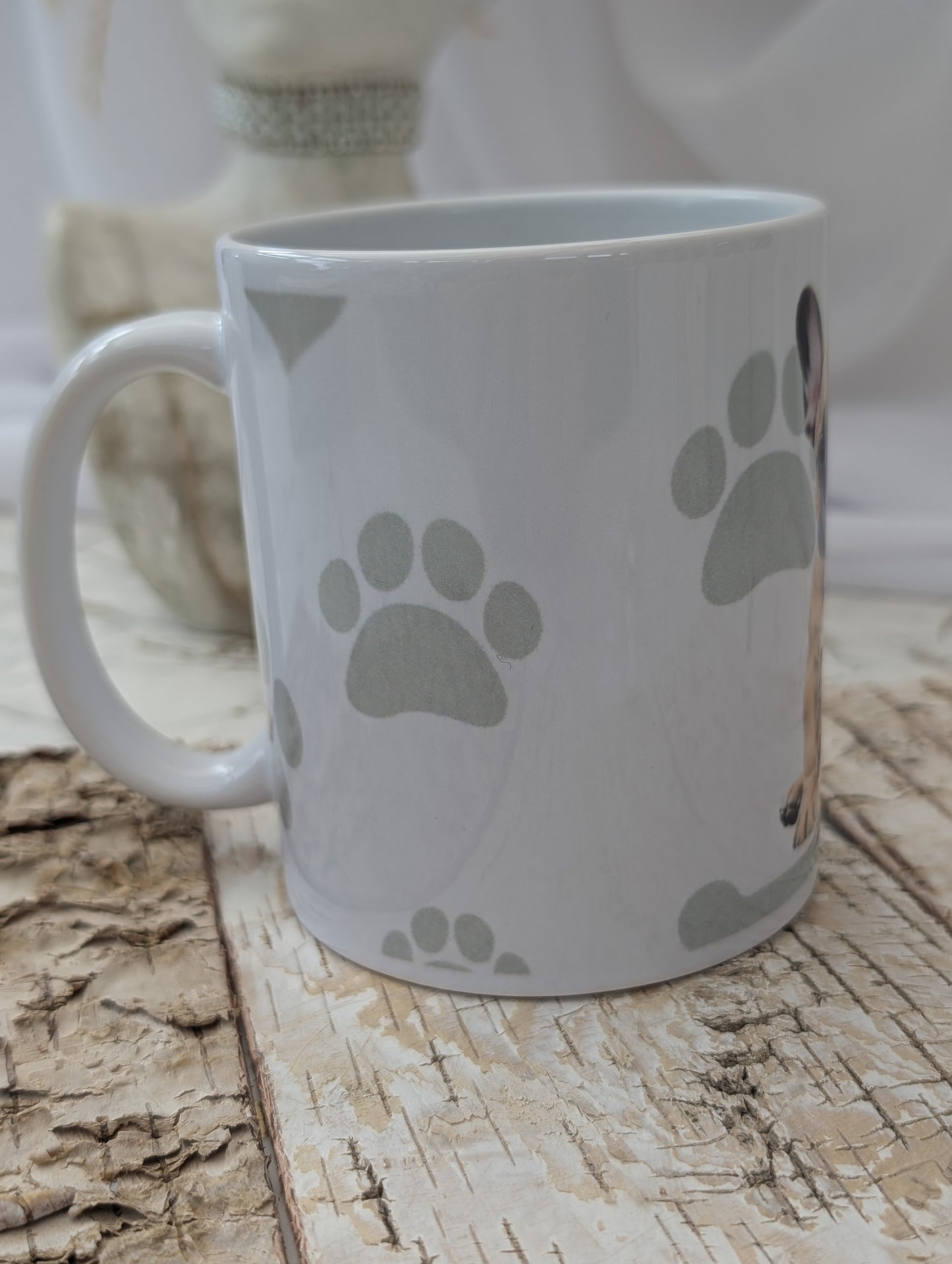 Side view of Ceramic Dog mug with fabulous watercolour image of tan and white French Bulldog against a background of soft grey colour hearts, bones and pawprints.