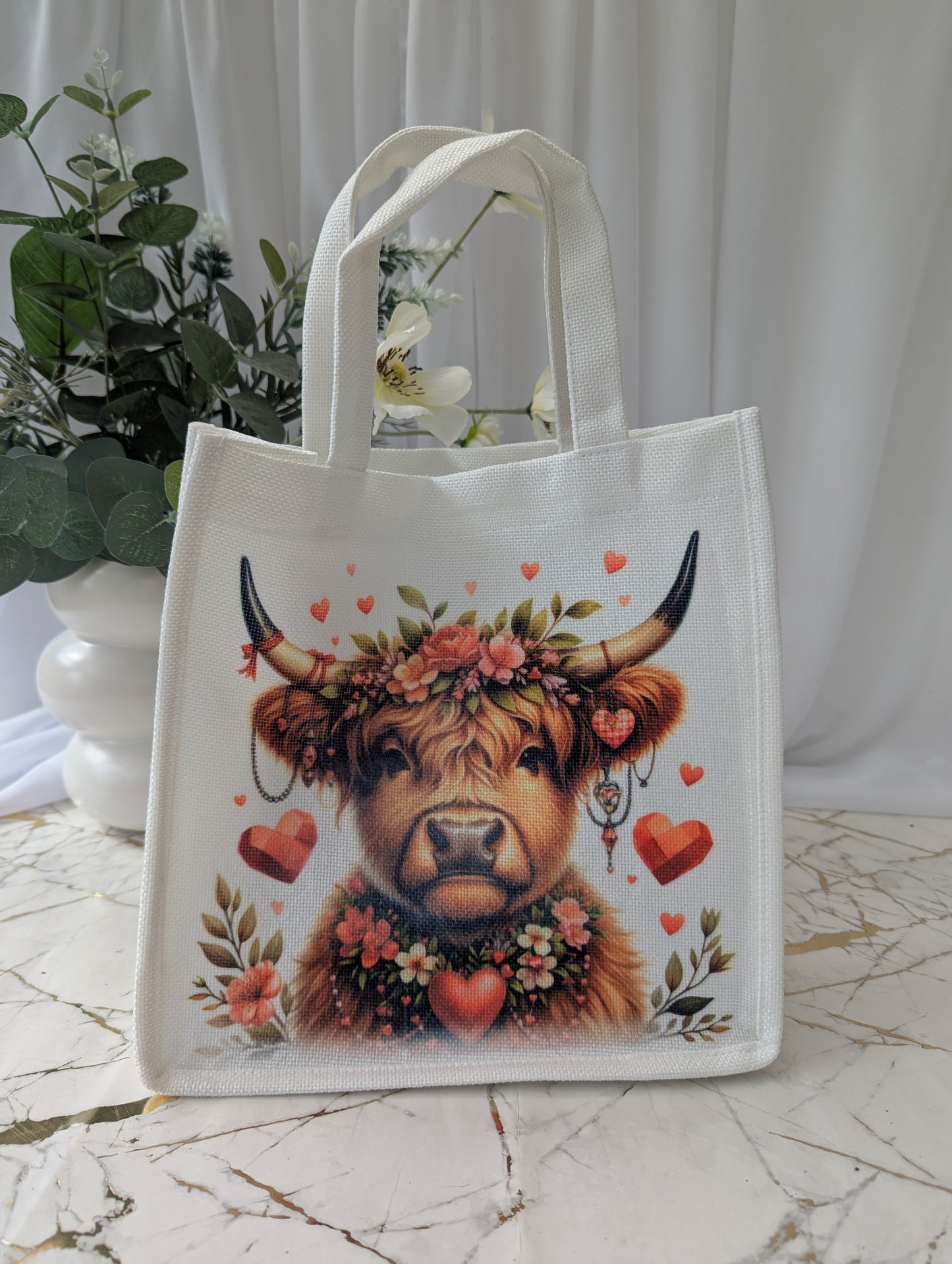 Highland Cow tote bag - image adorned with flowers and hearts