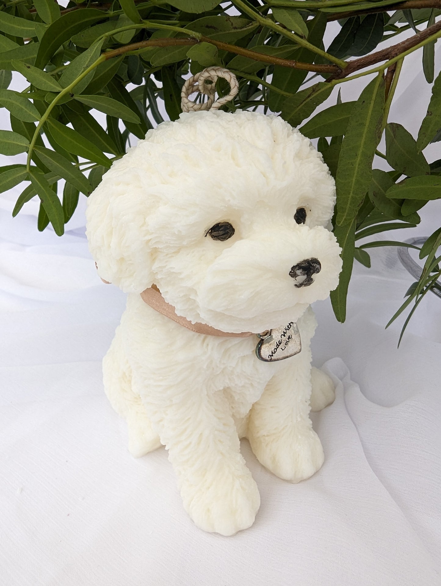 Side view of coconut and rapeseed Cavapoo moulded candle