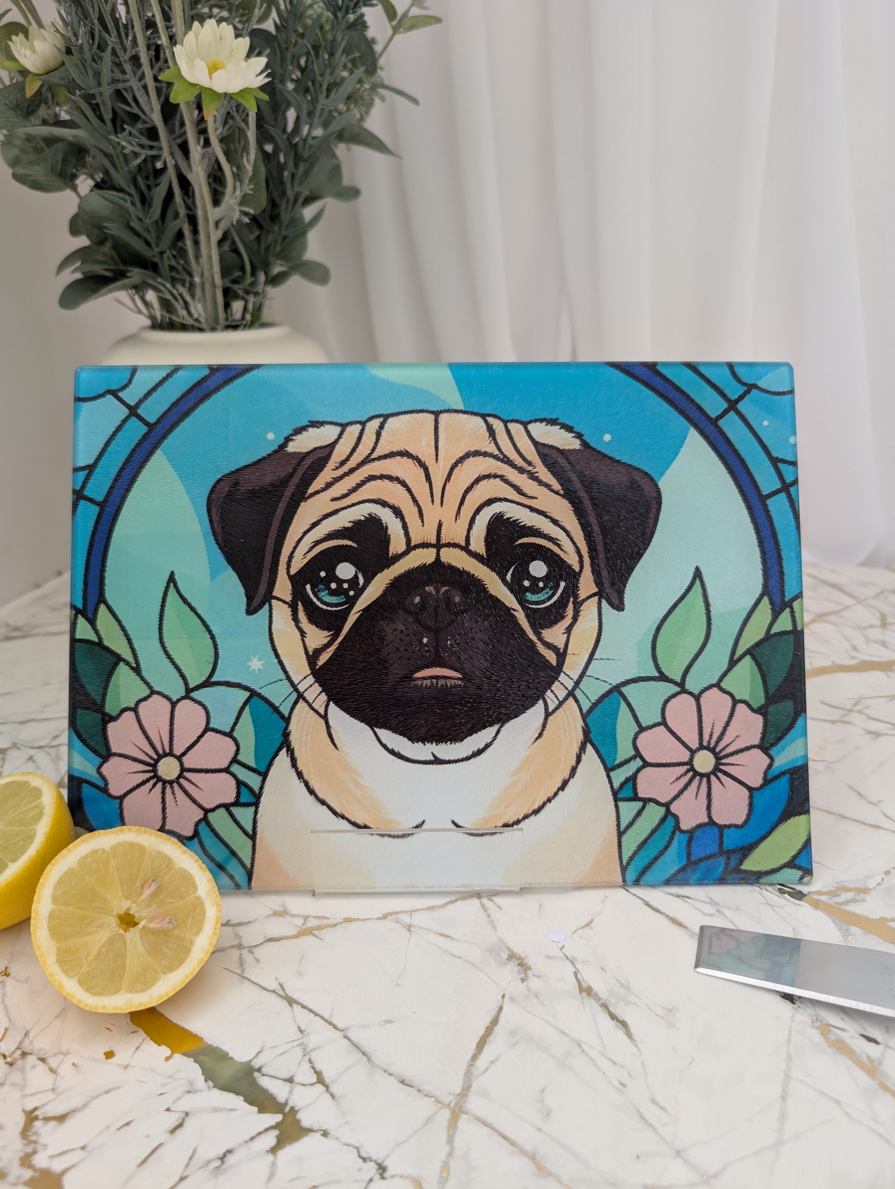 cute cartoon style Pug toughened glass chopping board.  Stained glass style with background in blues and greens
