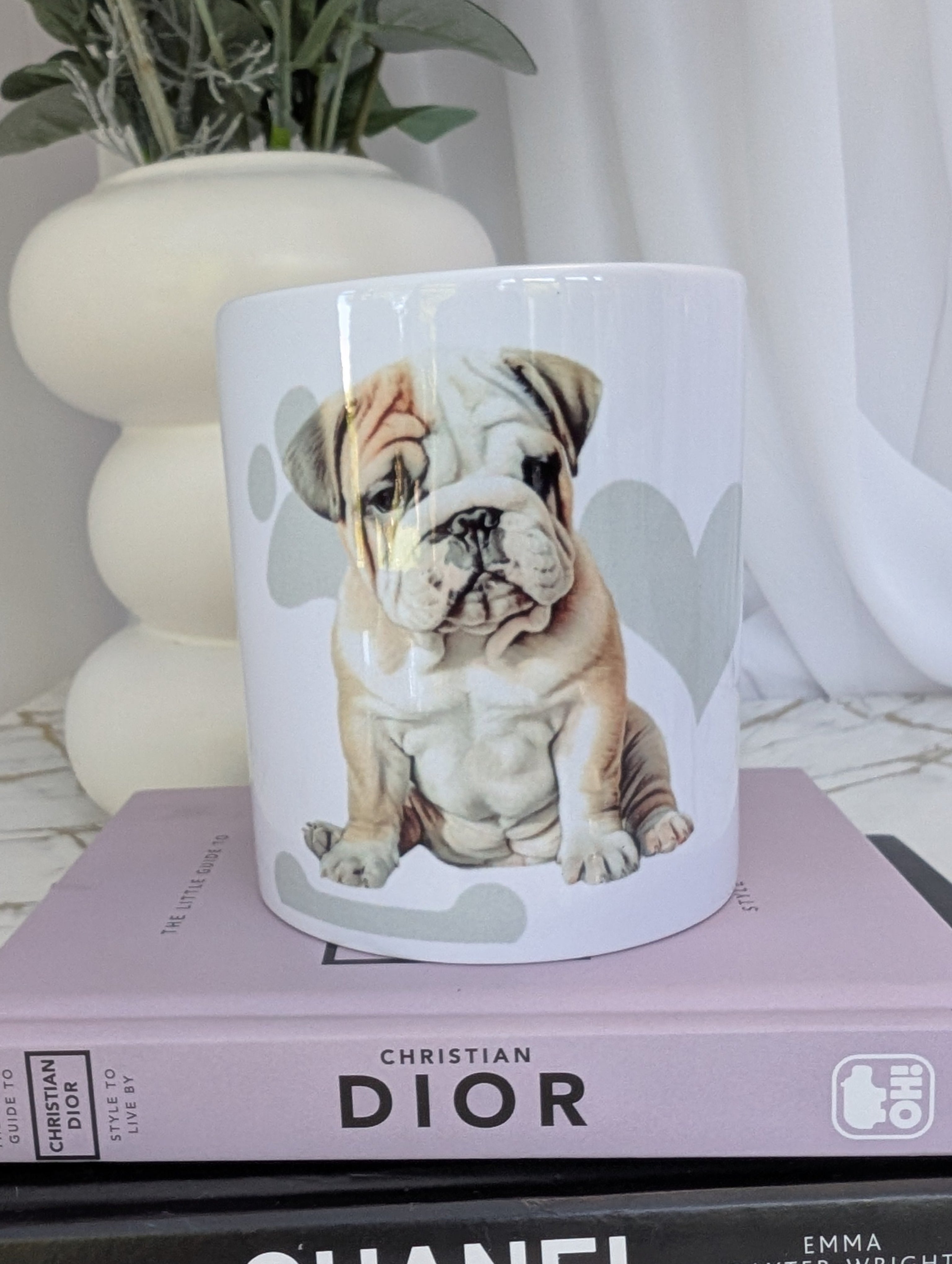 White Ceramic Bulldog mug, with soft grey background of hearts, paws and bones.