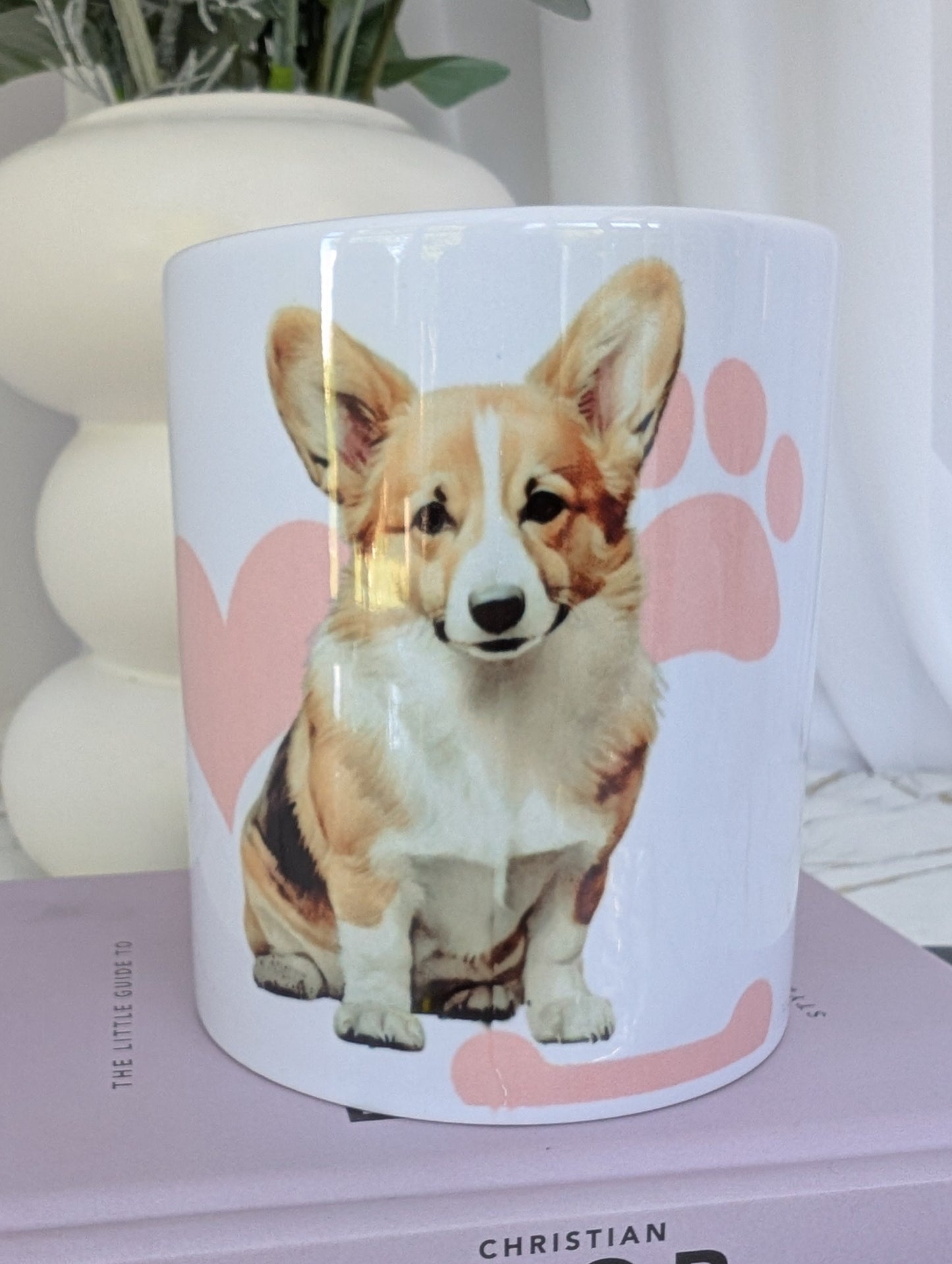 White ceramic Welsh Corgi mug with pink bones, paws and heart background