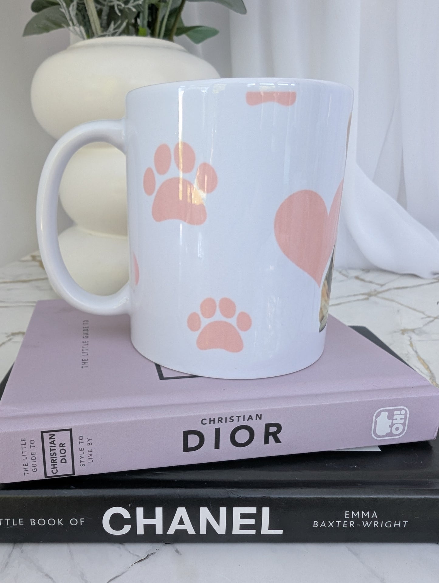 Right side view of white corgi mug showing pink pawprint and heart background