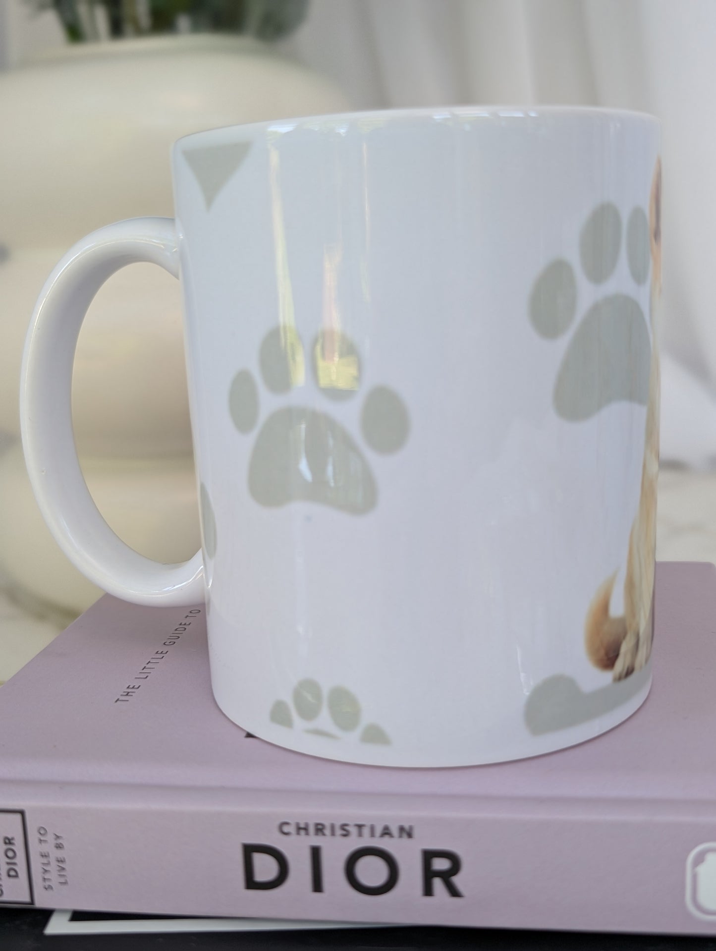 Right side view of Shiba Inu mug, watercolour style image on white ceramic mug with background of pale grey hearts, paws and bones
