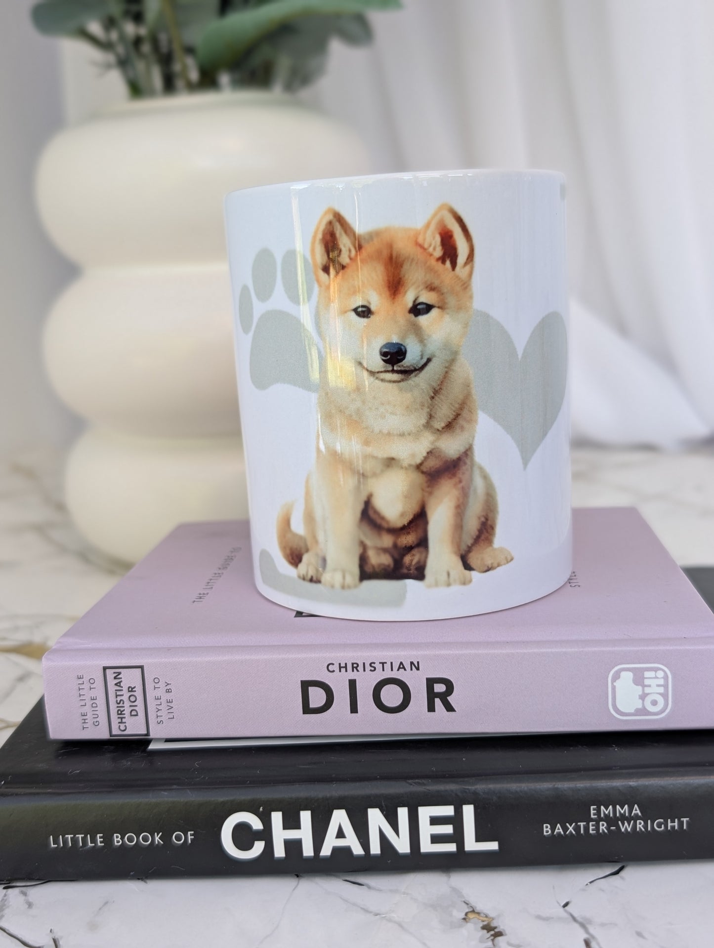 Shiba Inu puppy mug, watercolour style image on white ceramic mug with background of pale grey hearts, paws and bones