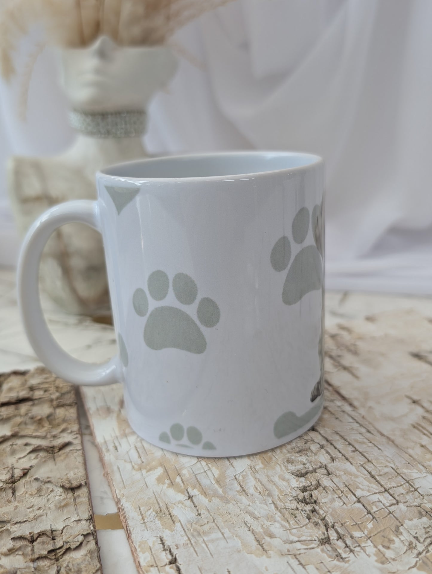 right side view of White Ceramic Weimaraner Dog Puppy mug with background of soft grey hear, paw and bone print