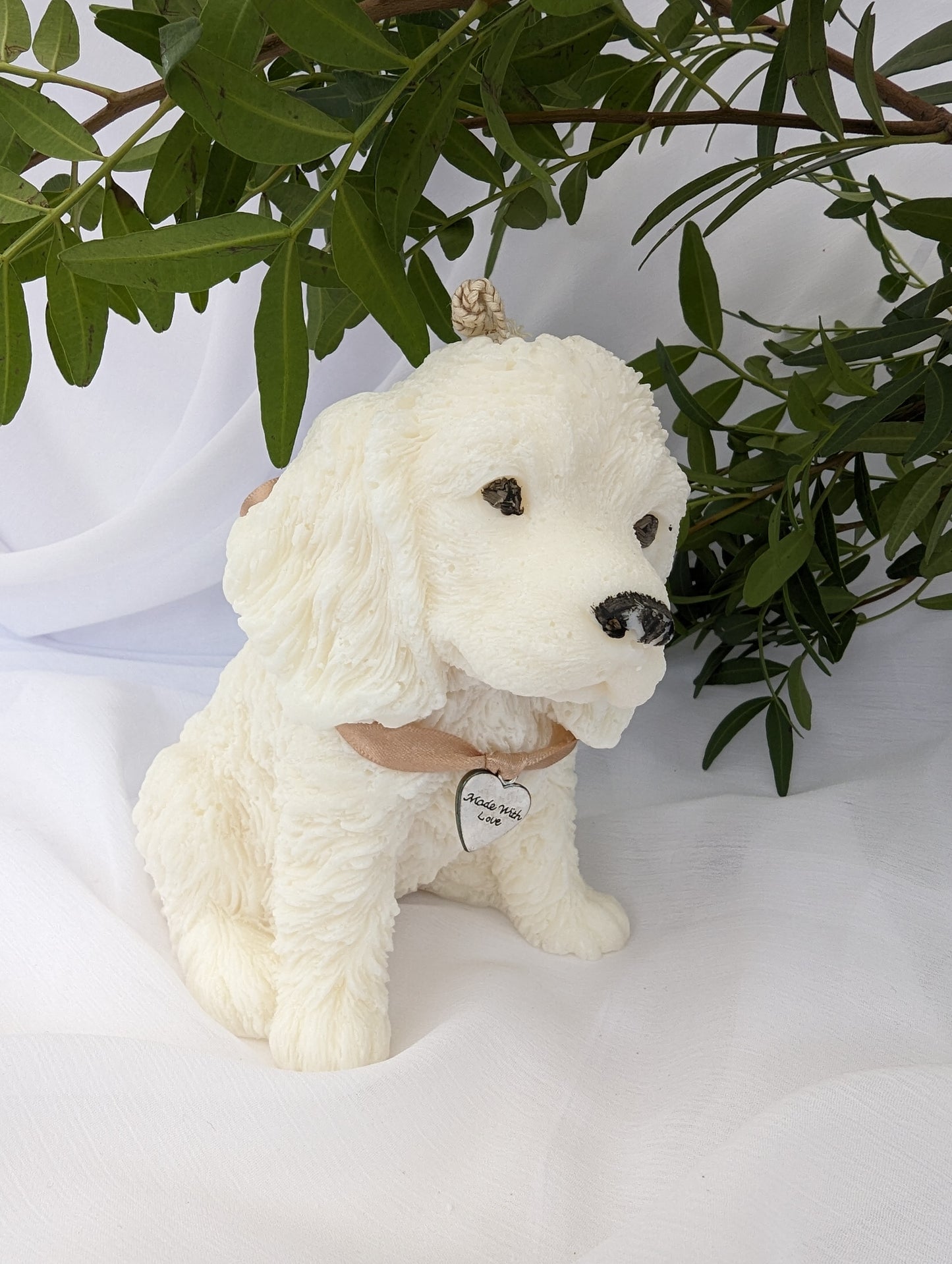 Profile image of moulded shaped cocker spaniel dog candle with ribbon and charm detail around the neck