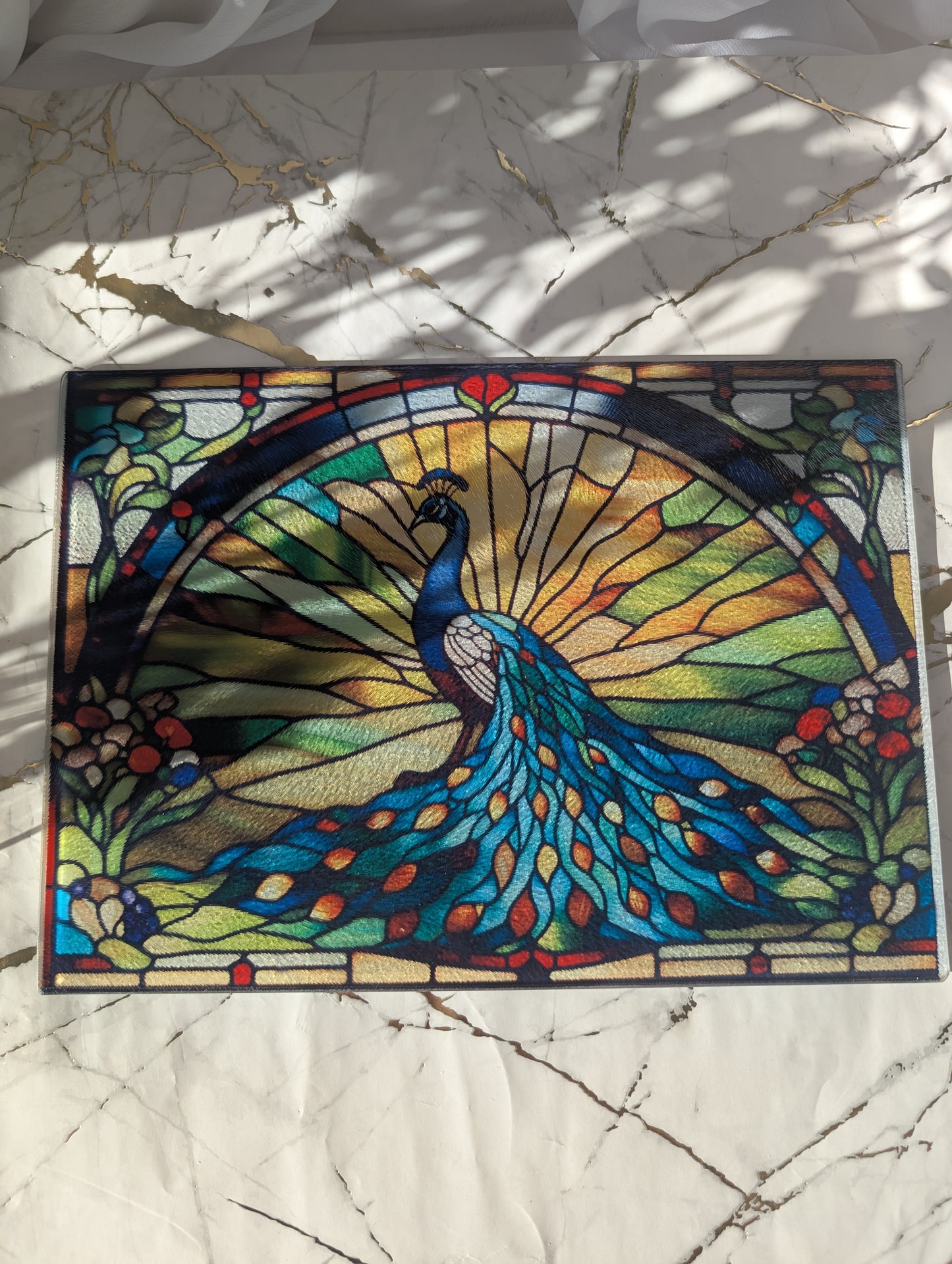 Top view of Peacock stained glass style chopping board