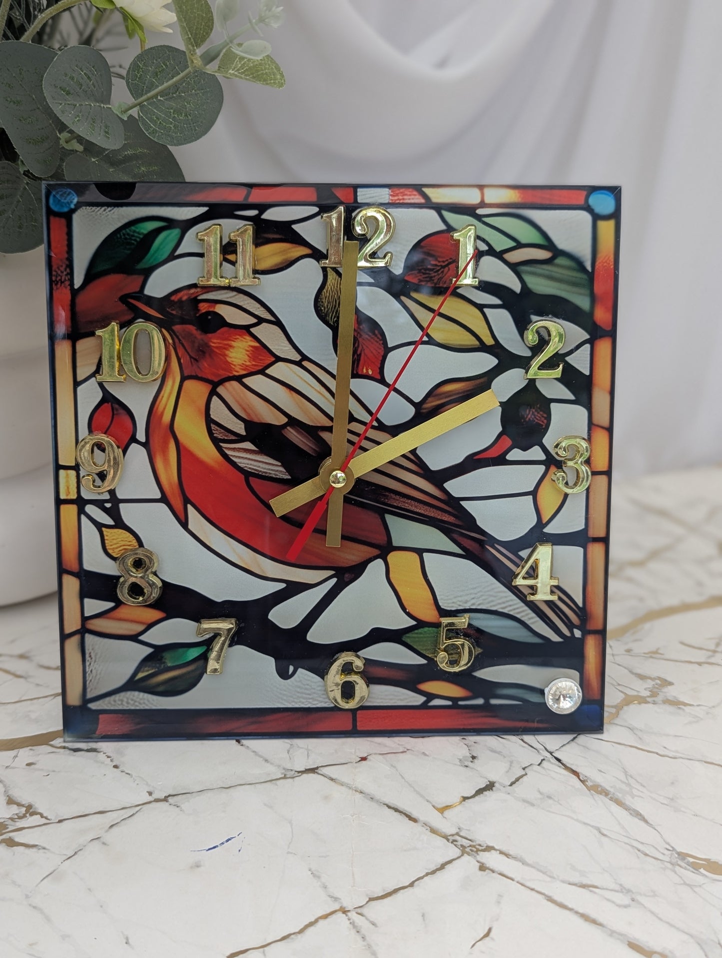 Stained glass robin clock, ideal for desks, shelves, or gift displays.