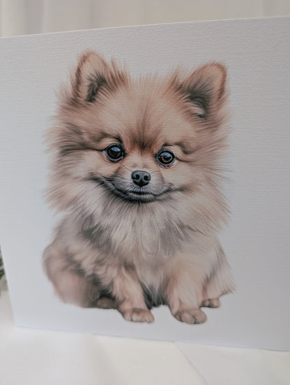 close up view of 6 x 6 inches white linen effect greeting card printed with watercolour style image of a cute Pomeranian.