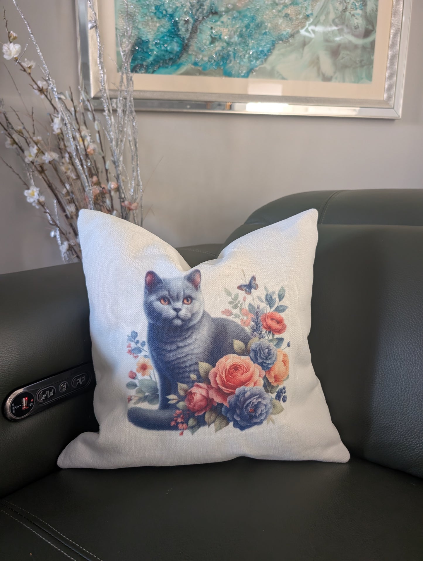 Black Cat Cushion on cream linen effect fabric with floral design