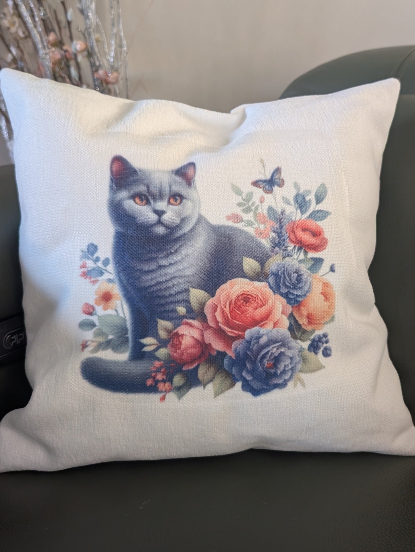 Black Cat Cushion - close up of cat and floral design