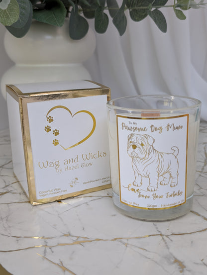 Dog Mum Candle. Front view of "Pawsome Dog Mum" candle in clear glass container - foiled label, with Wag and Wicks white and gold box
