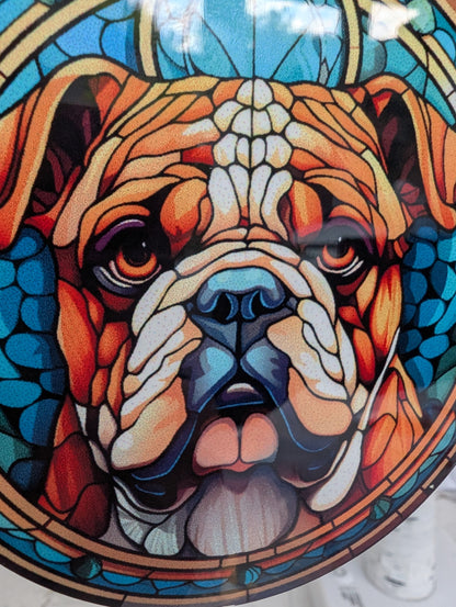 extreme close up of Bulldog hanging ornament in stained glass style, featuring a British Bulldog on a blue background, showing detail of Bulldog face