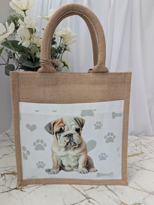 Bulldog tote bag made of sustainably sourced jute.  With cream front pocket printed with cute bulldog image against a background of soft grey pawprints hearts and bones