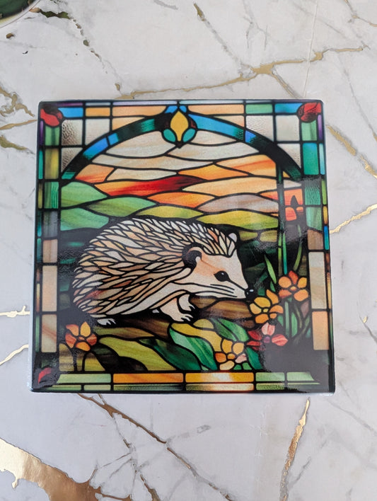 Top view of ceramic hedgehog coaster.  The perfect gift for hedgehog lovers, this is 9cm square and stained glass effect design