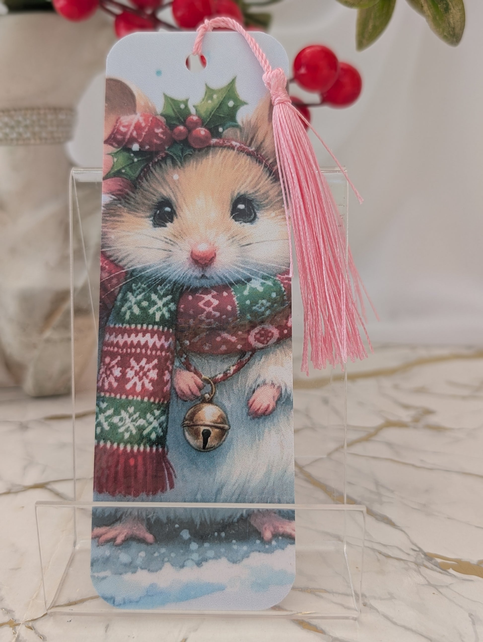 Bookmark with a festive mouse design on a clear stand.