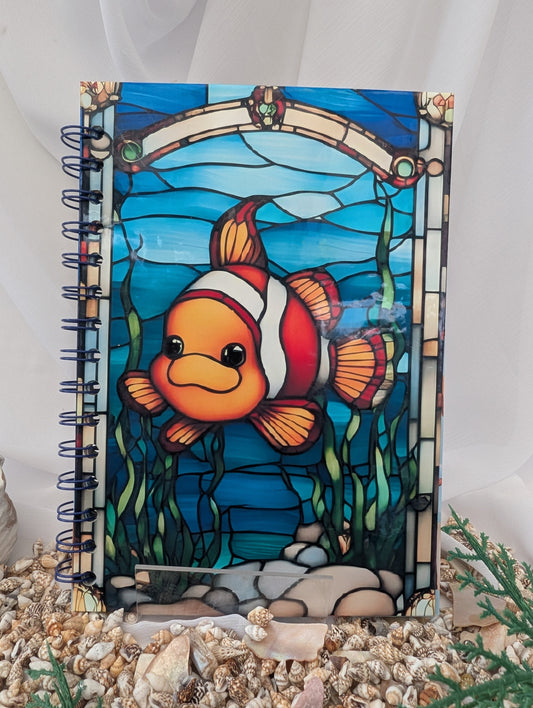 Notebook with a colorful clownfish design on a white background