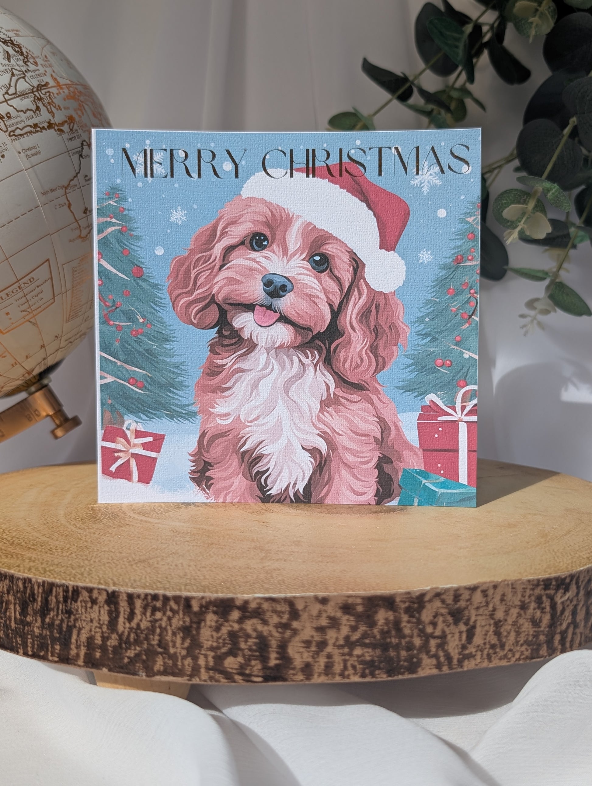 Personalised Dog Christmas card featuring a tan and white cockapoo/cavapoo wearing a Santa hat 