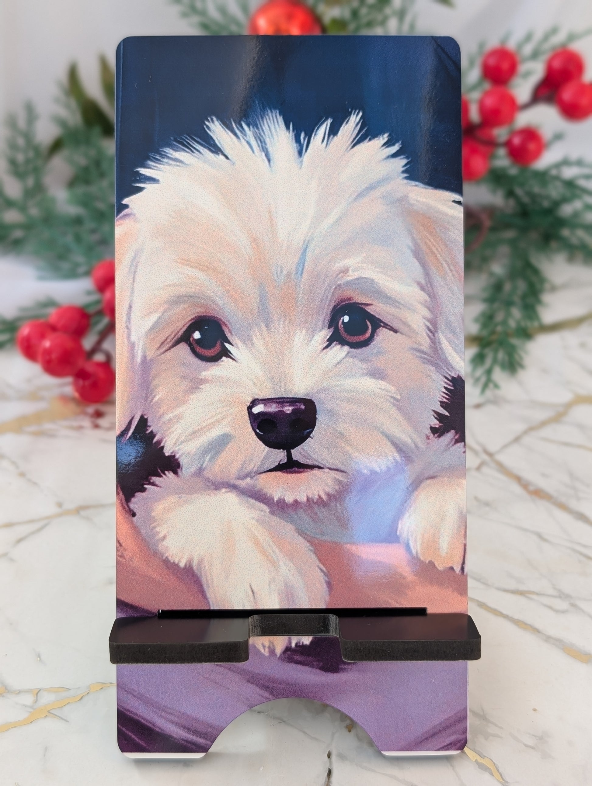 Phone stand with a colorful illustration of a dog on a blue background, surrounded by red berries and greenery.
