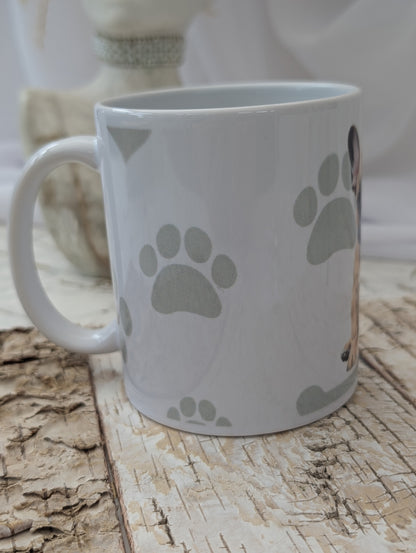 Side view of Ceramic Dog mug with fabulous watercolour image of tan and white French Bulldog against a background of soft grey colour hearts, bones and pawprints.