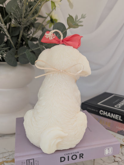 Back view of dog shaped candle - shih tzu natural colour coconut and rapeseed wax with pink ribbon and removable charm