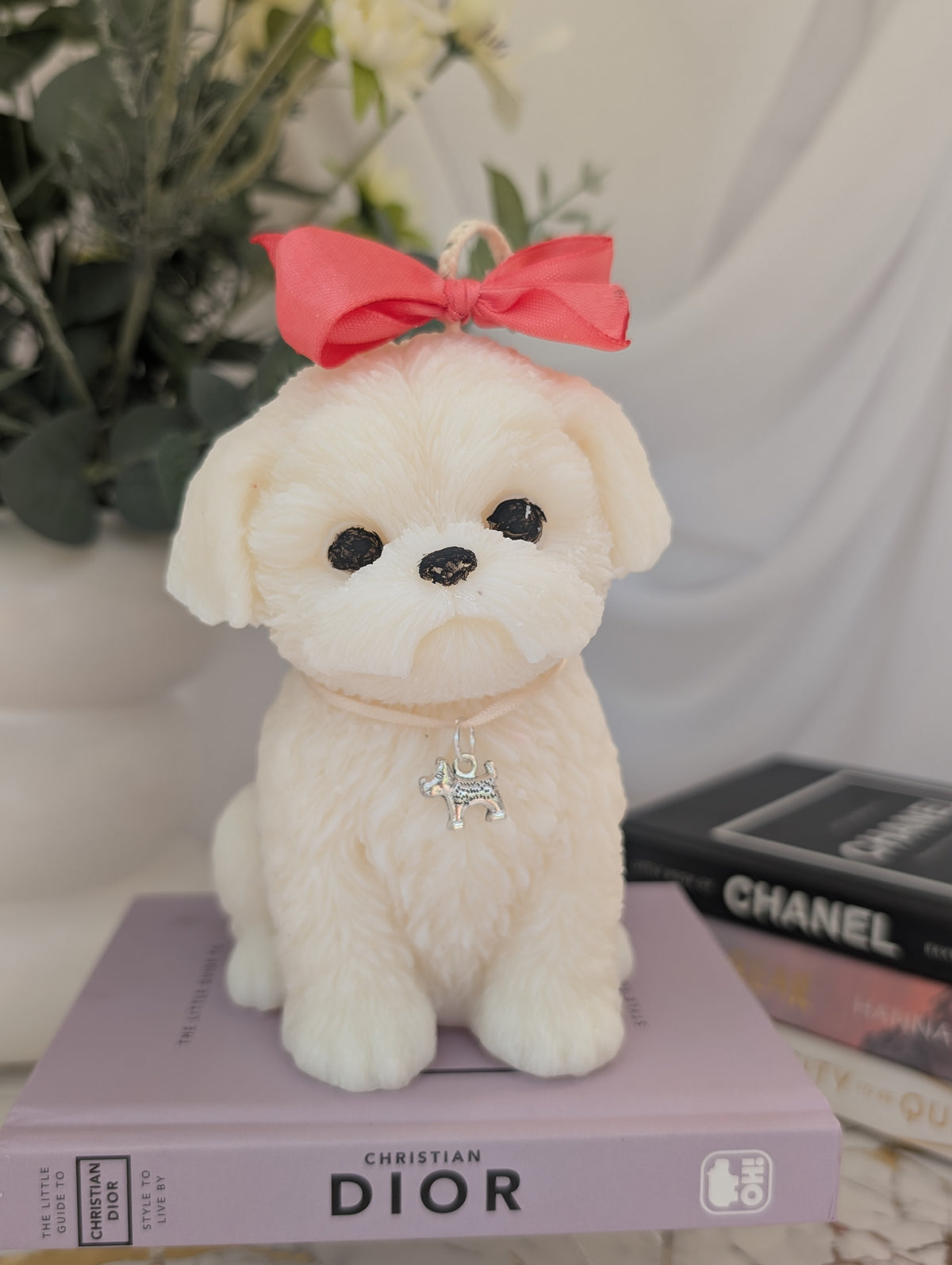 Shih Tzu Dog Shaped Candle on top of a Dior Book, by Hazel Glow