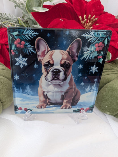 Decorative glass Coaster with a French Bulldog illustration on a stand, surrounded by festive decorations.