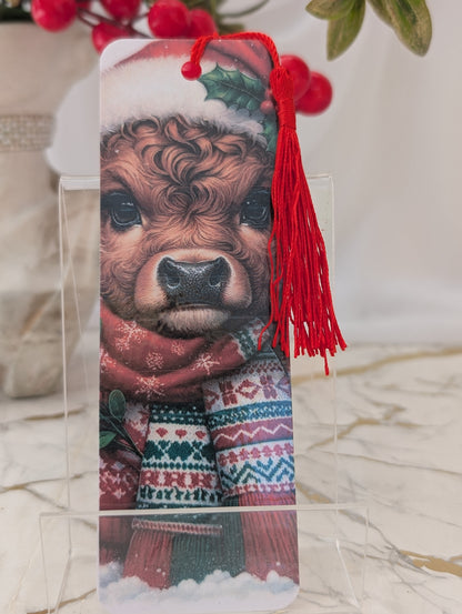 Christmas gift idea - highland cow bookmark. Christmas themed, wearing a santa hat and Christmas scarf