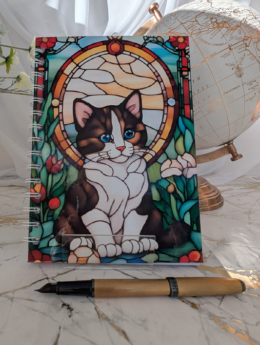 Quirky stain glass style kitten notebook.  A5 style, hardback with 120gsm lined paper.