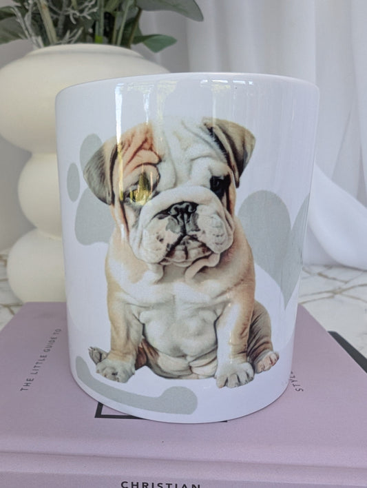 White ceramic Bulldog mug, watercolour style image on a background of pale grey paws, hearts and bones
