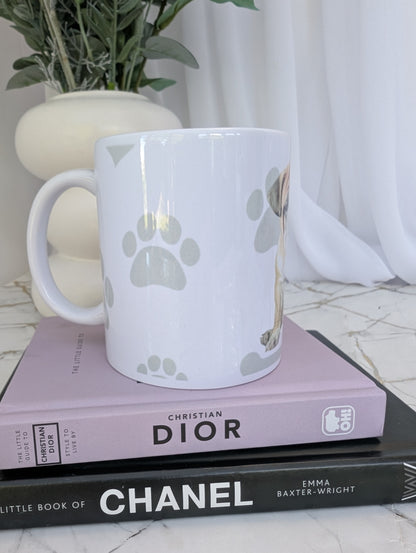 side view of white ceramic Bulldog mug, watercolour style image on a background of pale grey paws, hearts and bones