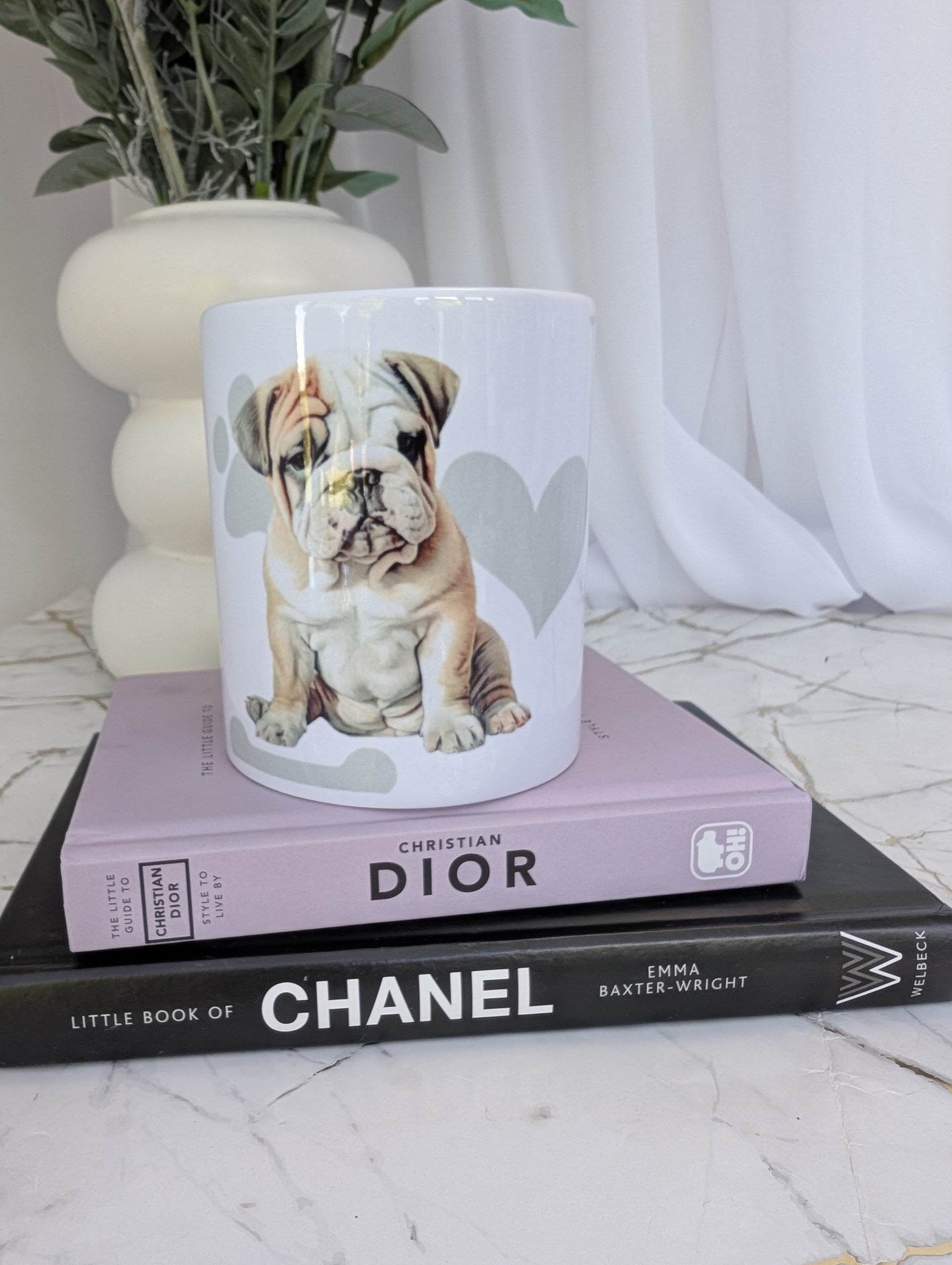 White ceramic 11oz Bulldog mug, watercolour style image on a background of pale grey paws, hearts and bones