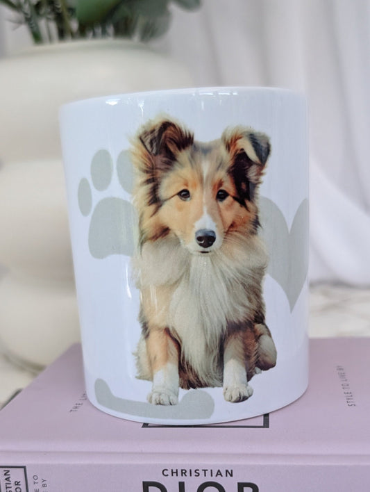 11oz white ceramic Border Collie mug, with watercolour style image of Border collie against a background of soft grey hearts, pawprints and bones