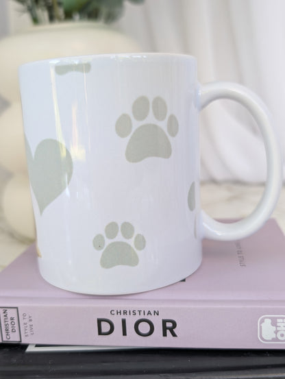 Left side view of Shiba Inu mug, watercolour style image on white ceramic mug with background of pale grey hearts, paws and bones