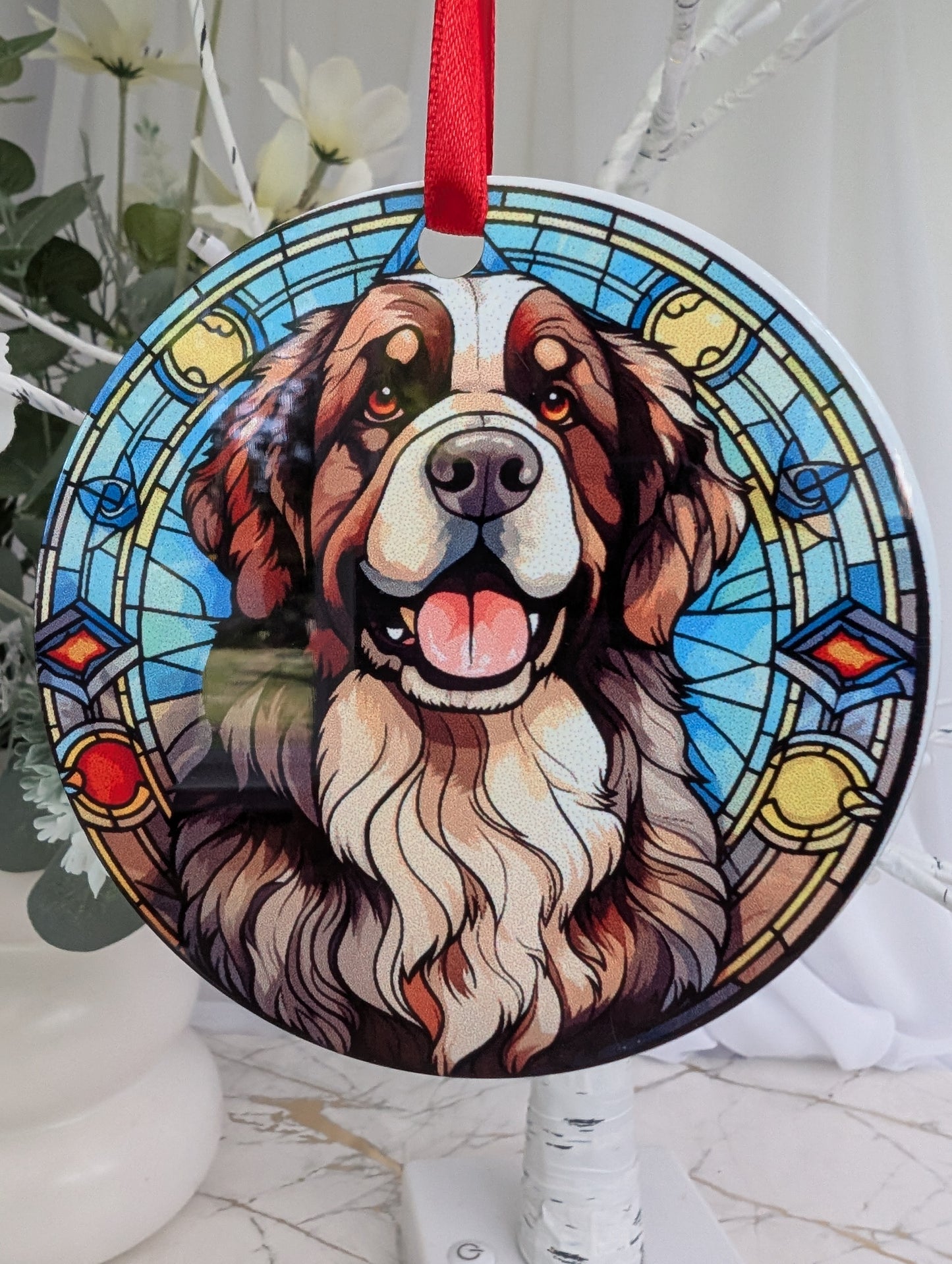 close up of round, Stained glass effect, Newfoundland Dog ornament on an aluminium base.  
