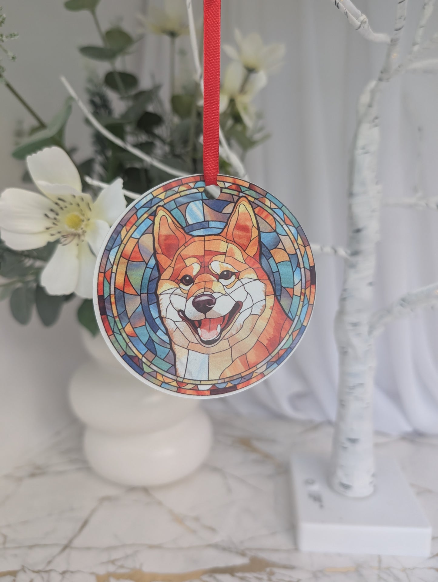 Round, multi colour, stained glass style Shiba Inu hanging ornament with red ribbon
