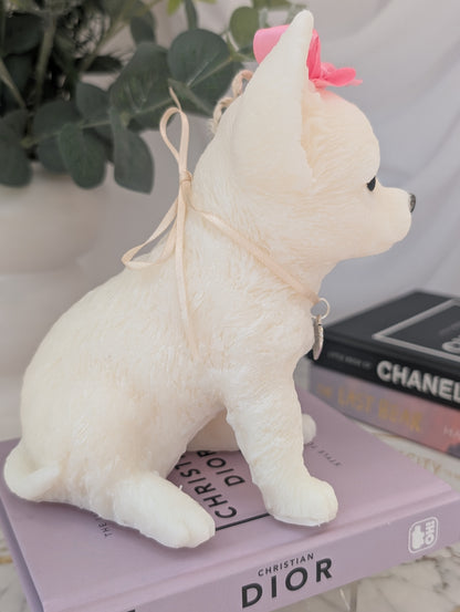 Right-side view of realistic wax Chihuahua candle showing elegant detailing in face and posture, with charm embellishments around neck and head.