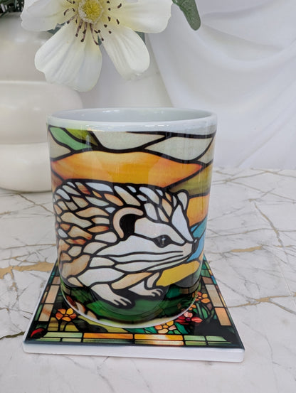 close up of ceramic hedgehog mug on top of hedgehog coaster.  The perfect gift for hedgehog lovers, this is 9cm square and stained glass effect 