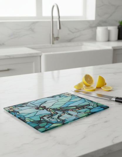 Toughened glass chopping board with a praying mantis design in stained glass style on a marble work surface