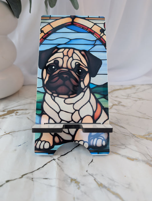 Mobile Phone stand with pug design in stained glass style on a marble surface